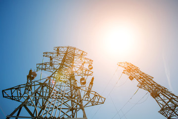 Power tower in the sky background, high-voltage post or high-voltage tower in the sunlight