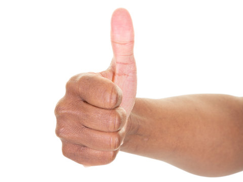 Thumbs up in front of white background with copy space african american