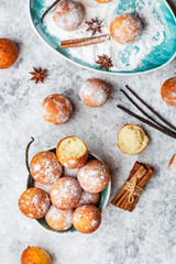 small balls cottage cheese doughnuts in powdered sugar