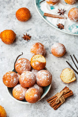small balls cottage cheese doughnuts in powdered sugar