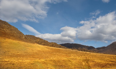 Fototapeta premium Russia. mountain Altai. The surrounding mountains regional center Onguday along tchuisky highway.