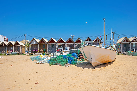 Traditonal fisherman huts on the beach in Armacao de Pera in the Algarve Portugal