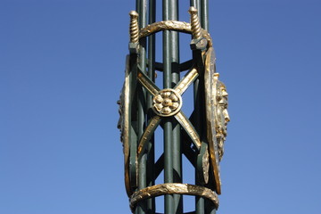Fototapeta na wymiar Golden lamp post decoration on blue sky background 