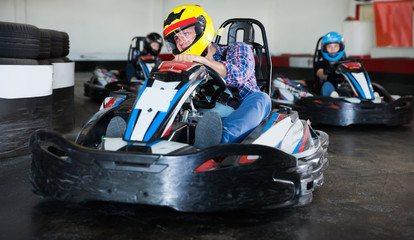 Portrait of adult man driving racing car