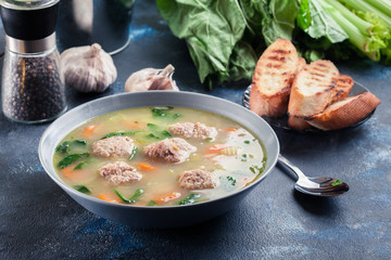 Italian wedding soup with meatballs and vegetables