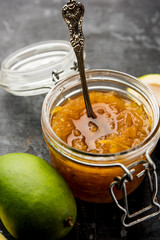 Mango Chunda or Sakhar Amba is a traditional indian summer recipe made using accha aam preserved in sugar syrup for days. selective focus