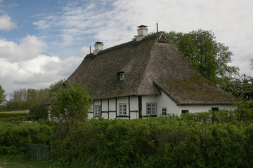Fototapeta na wymiar romantic thatched roof country house