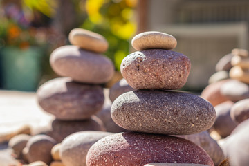 Fototapeta na wymiar Zen stones stack of pebble stones carefully stacked metaphor for wellness and meditation 