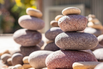 Fototapeta na wymiar Zen stones stack of pebble stones carefully stacked metaphor for wellness and meditation 