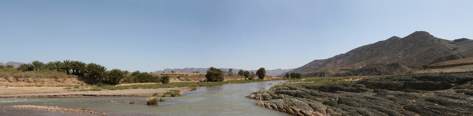 Panoramic photos of buildings and ancient historical places called alqasbat and oases and natural mountains in Morocco are located in the Ouarzazate region near the Moroccan Sahara