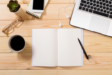 Working space. Laptop, notepad on wooden desk