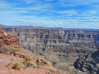 people on a rock in the grand canyon