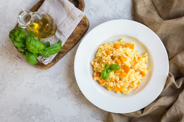 Risotto vegan made from rice carnarolli, pumpkin, white wine and onion.