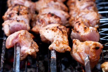 Roasted meat cooked at barbecue with smoke