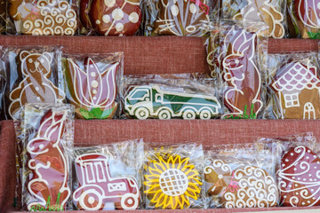 Different types of decorated gingerbread at a candy store in individual plastic packaging