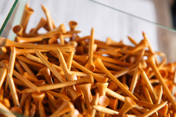 wooden golf pins up close