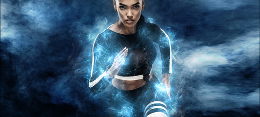 Strong athletic, woman sprinter or runner. Girl wearing in the sportswear runing outdoor. Fitness, sport motivation concept with copy space. Run in energy power.
