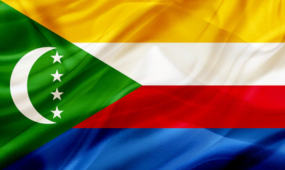 Obraz premium Comors Islands country flag on silk or silky waving texture