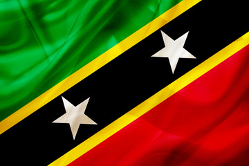 Saint Kitts and Nevis country flag on silk or silky waving texture