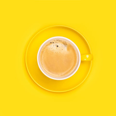 Yellow coffee cup on yellow background, flat lay