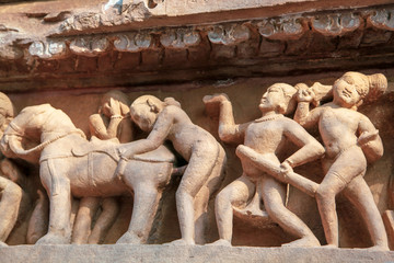 Sculptures depicting people having sex on the walls of ancient temples of Kama Sutra in India kajuraho. UNESCO world heritage site. The most famous landmark in India. Temple of love