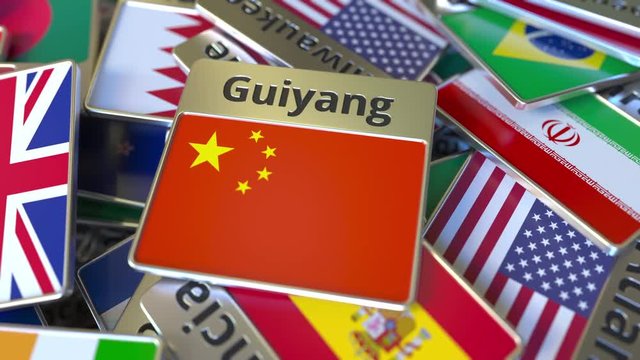 Souvenir magnet or badge with Guiyang text and national flag among different ones. Traveling to China conceptual intro animation