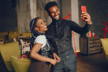 Stylish and beautiful blond couple standing in a cafe