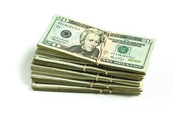 pile of US currency twenty dollar bills featuring Andrew Jackson bundled with rubber bands