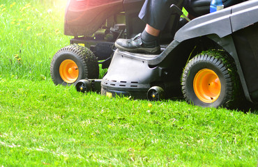 Green grass mowing with lawn mower