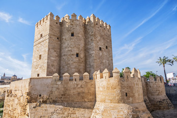 Naklejka premium View of Cordoba Calahorra Tower. Tower of Calahorra - fortress of Islamic origin conceived as an entrance and protection Roman Bridge of Cordoba across Guadalquivir River. Cordoba, Andalusia, Spain.
