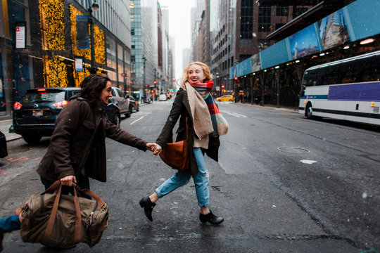 Excited vacationers walking on the streets of New York City