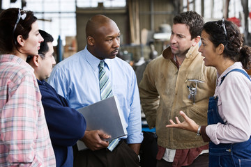 Factory workers in a meeting