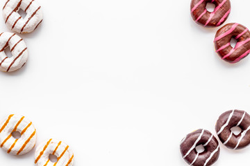 Traditional american donuts of different flavors frame on white background flat lay mockup