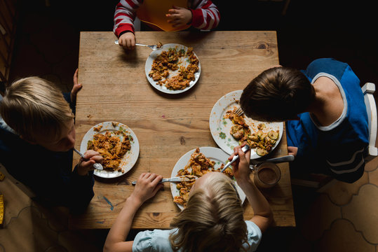 four kids eating together