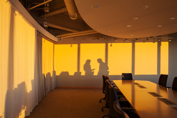 Office meeting shadows