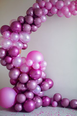 purple balloons of different sizes for the decoration of the holiday