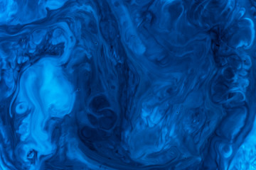 Abstract of blue paint in water