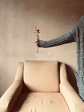 Woman holding flowers in a retro environment