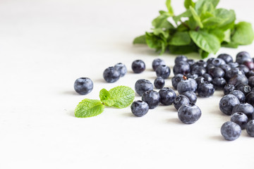 Ingredients for making tart, quiche, pie or cake - flour, eggs, milk, olive oil, spinach, green pea, cheese and butter. Food background. Copy space.