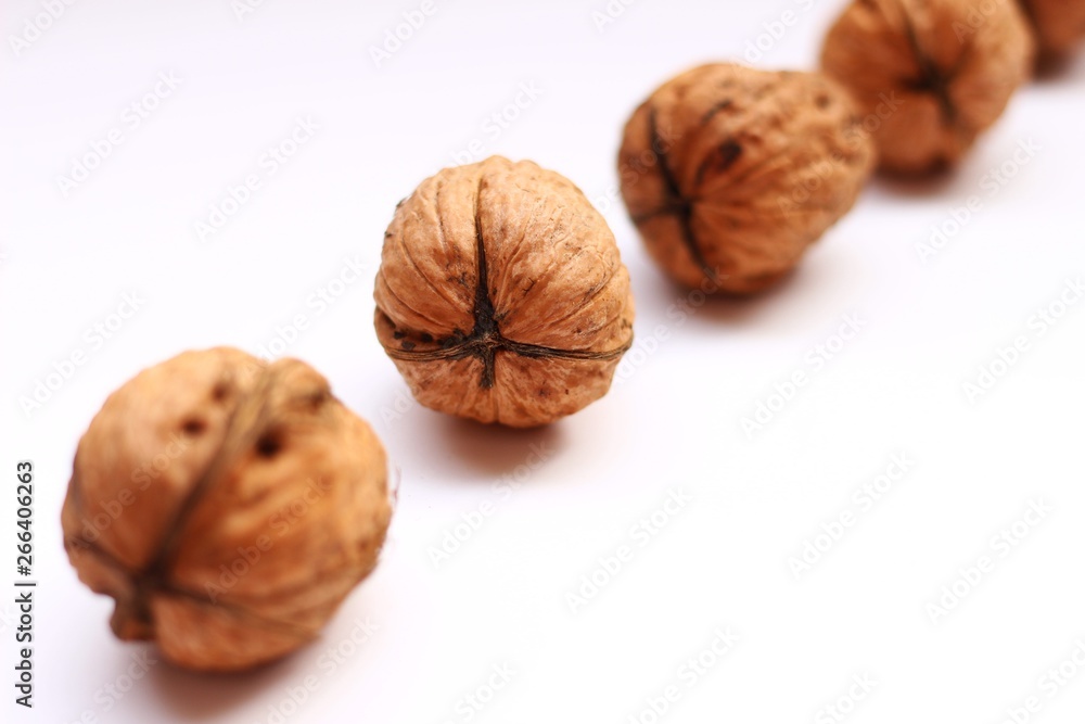 Wall mural Walnuts on a white background