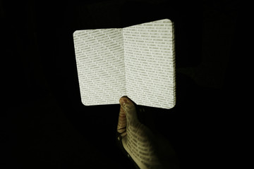 Binary Code projected onto physical notepad.