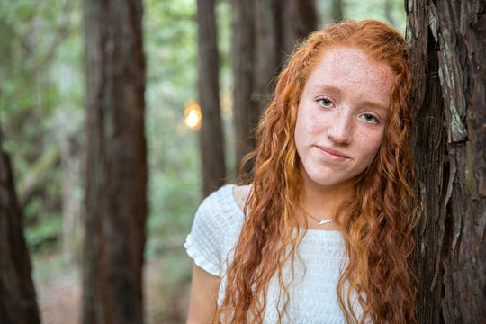 Beautiful redhead in the forest