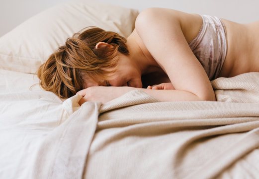 happy woman on the bed