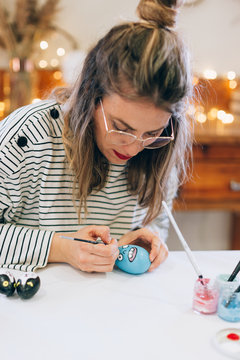Woman preparing easter in the workshop
