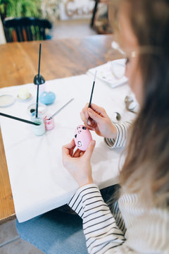 Woman preparing easter in the workshop
