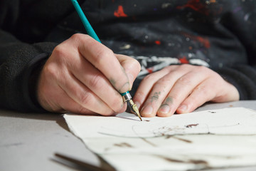 A calligrapher creating artworks in his workshop