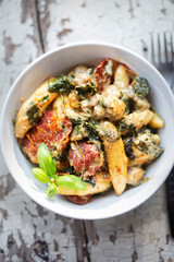 Potato dumplings, spinach, sun dried tomatoes and courgette in cheese sauce 