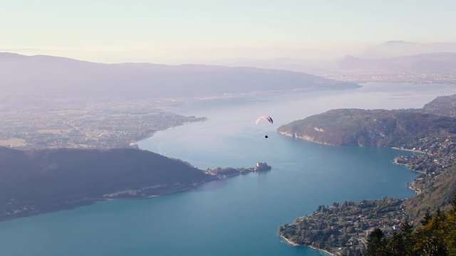 Annecy lake panoramic landscape view, paragliding sport in France