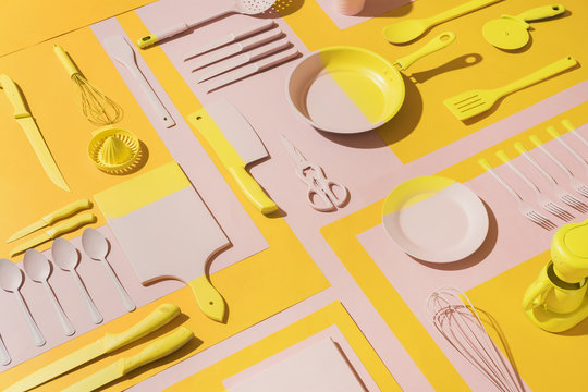 PInk and yellow kitchen objects/utensil.