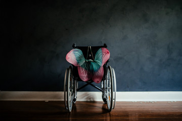 an empty wheelchair with wings
